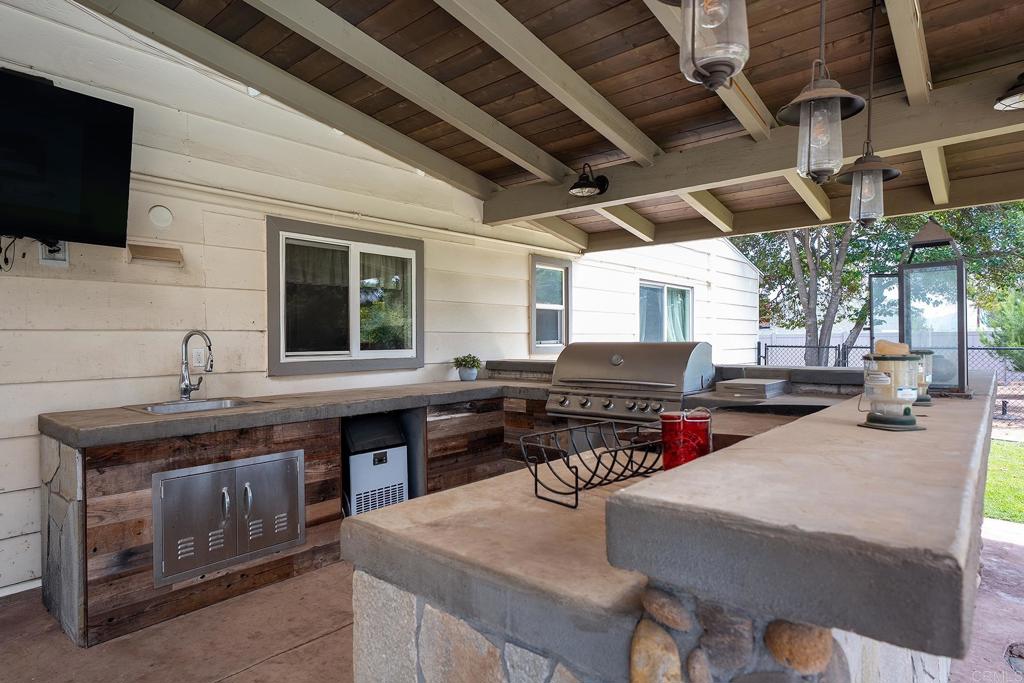 2430 Geyer Lane Alpine, CA 91901 - Photo 42 of 60 a kitchen with a stove a sink and a microwave