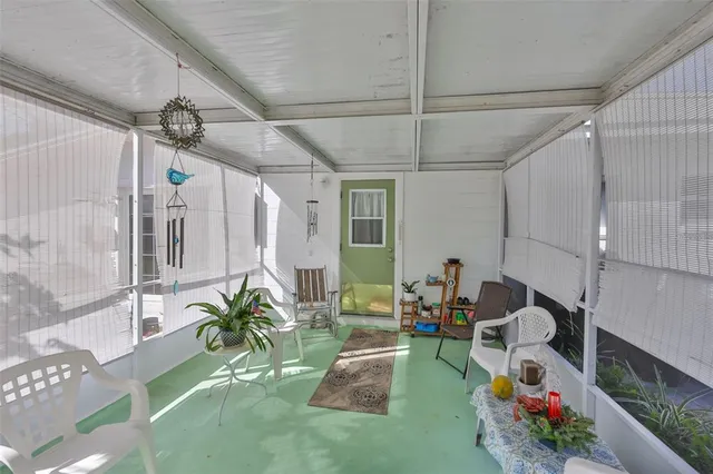 a living room with patio furniture