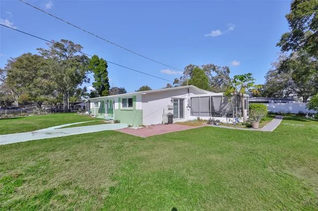 a view of a house with a back yard