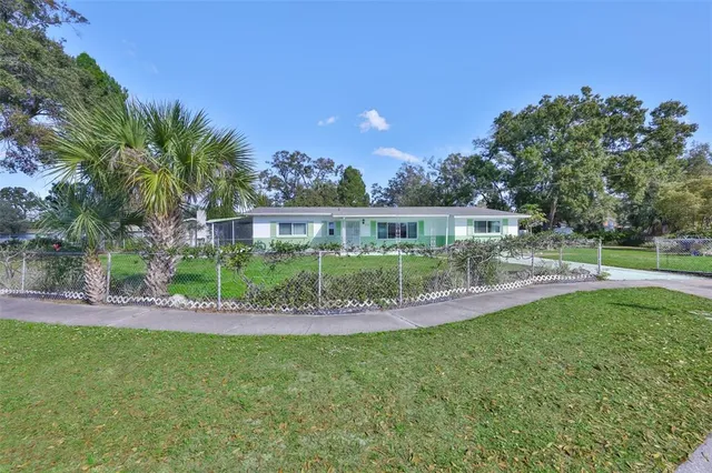a view of a house with a big yard