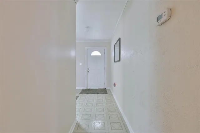 a view of a hallway with stairs