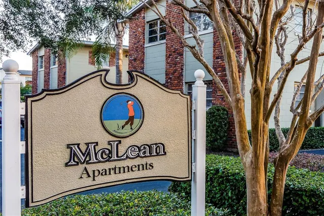 a view of sign board with a white house
