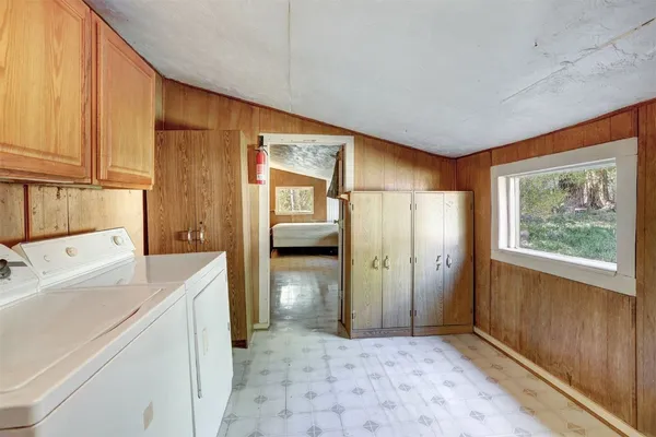 a view of a storage & utility room with a sink