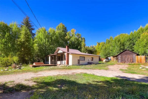 a view of a house with a big yard