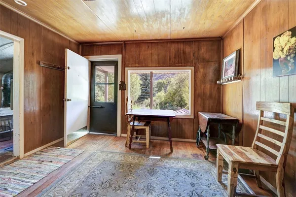 a view of a livingroom with furniture and a window