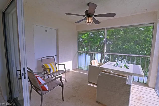 a dining room with wooden floor fan and furniture