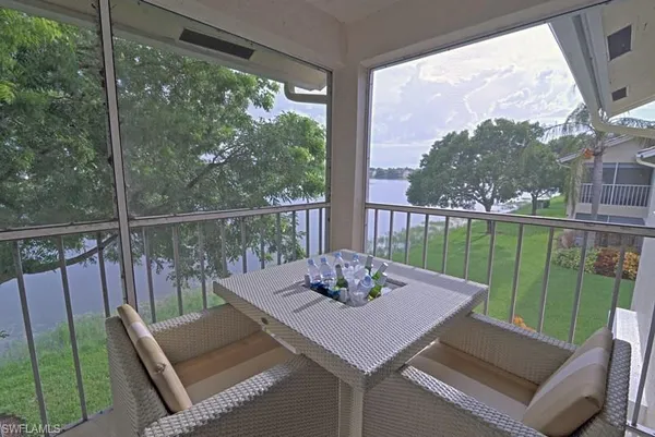 a view of a patio with a table chairs and a table