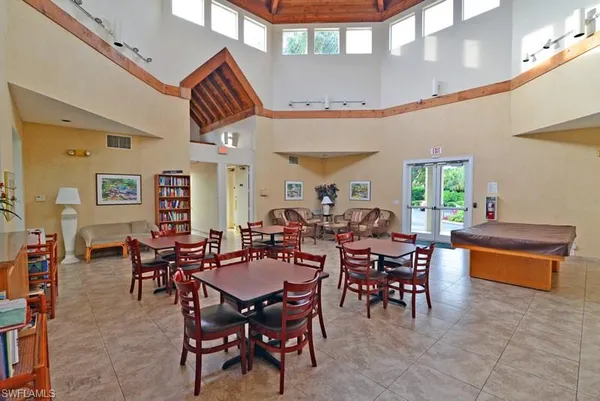 a group of people sitting at tables in a room