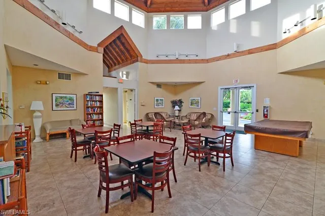 a group of people sitting at tables in a room