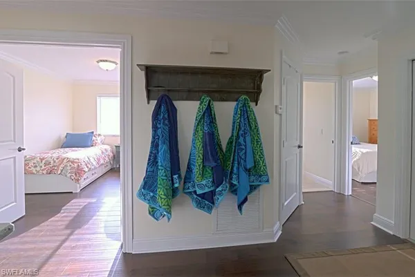 a living room with a couch and a walk in closet