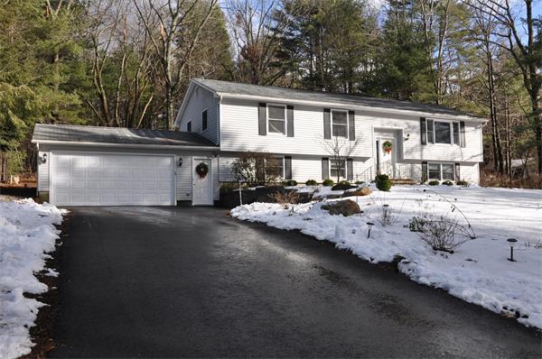 108 Clark Road Sturbridge, MA 01518 - Photo 1 of 30 a view of a white house with a yard and sitting area