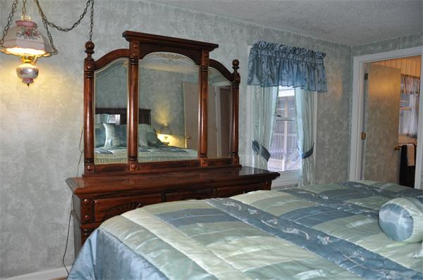 108 Clark Road Sturbridge, MA 01518 - Photo 11 of 30 a bedroom with a bed and a mirror