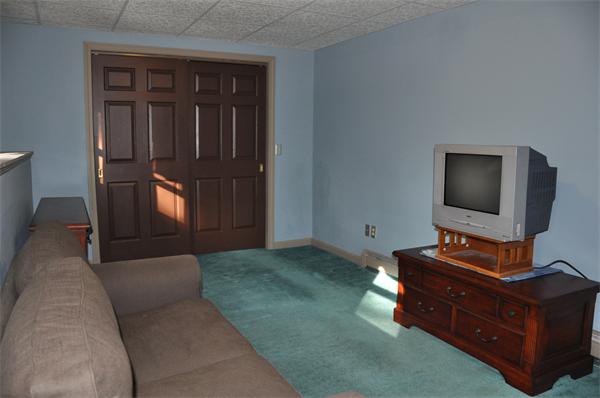 108 Clark Road Sturbridge, MA 01518 - Photo 25 of 30 a living room with furniture and a flat screen tv