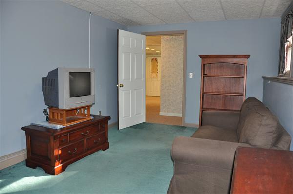 108 Clark Road Sturbridge, MA 01518 - Photo 26 of 30 a living room with furniture and a flat screen tv