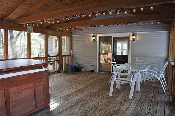 108 Clark Road Sturbridge, MA 01518 - Photo 29 of 30 a view of a patio with table and chairs with wooden floor