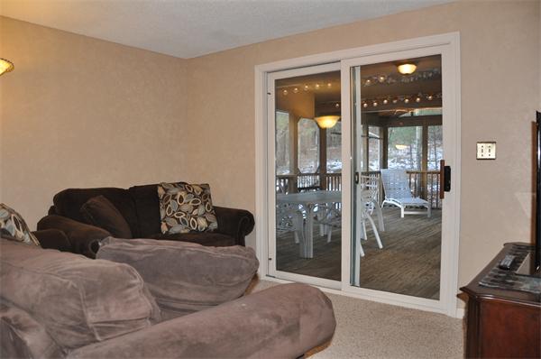 108 Clark Road Sturbridge, MA 01518 - Photo 5 of 30 a living room with furniture and a floor to ceiling window