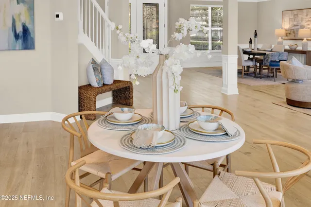 a large kitchen with kitchen island a large counter top space a sink stainless steel appliances and cabinets