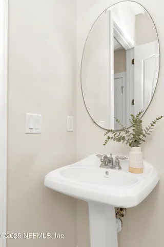 a living room with furniture a fireplace and kitchen view