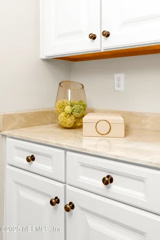 a bedroom with furniture and a large window