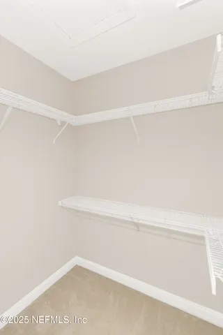 a view of small space with racks on the wall