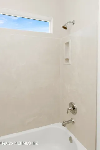 a bathroom with a bathtub