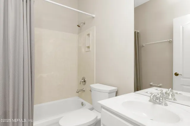 a view of a bathroom with a window and a bath tub