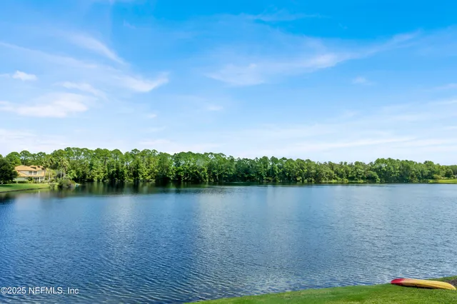 a view of lake with green space