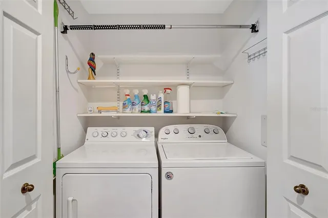 a living room with furniture and a mirror