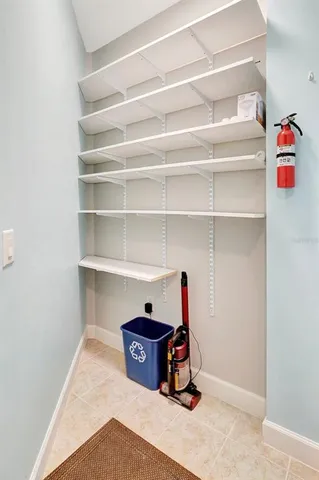 a view of a multi story residential apartment building with a yard