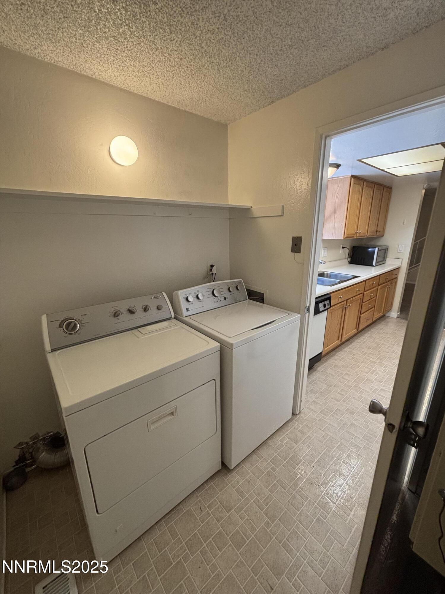 2412 Newcastle Way Reno, NV 89512 - Photo 18 of 31 Laundry Facing into Kitchen