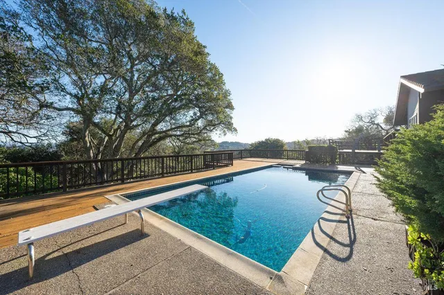 a view of swimming pool with a patio