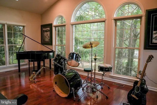 a kitchen with stainless steel appliances granite countertop a stove and wooden cabinets