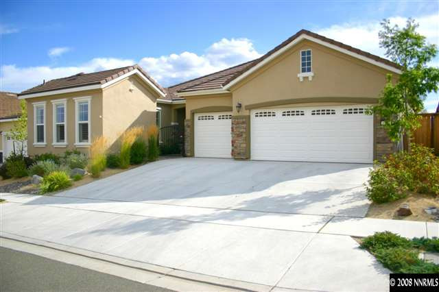 1285 Tarleton Way Reno, NV 89523 - Photo 1 of 9 a front view of a house with a yard and garage