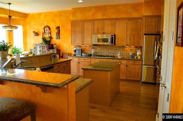 1285 Tarleton Way Reno, NV 89523 - Photo 5 of 9 a kitchen with stainless steel appliances granite countertop a sink refrigerator and cabinets
