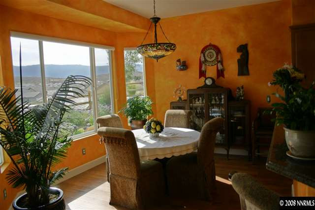 1285 Tarleton Way Reno, NV 89523 - Photo 8 of 9 a dining room with furniture garden view and a potted plant