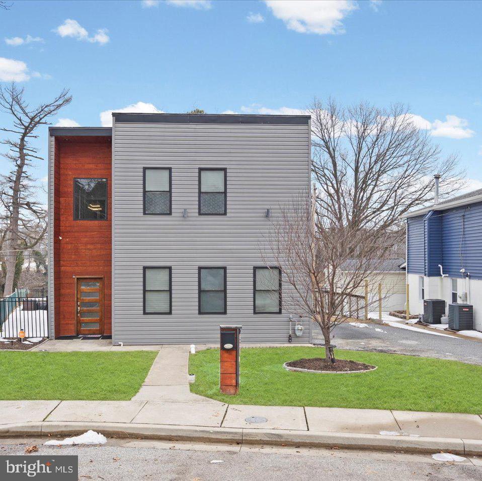 3145 Baybriar Road Dundalk, MD 21222 - Photo 1 of 54 a front view of a house with a yard and garage