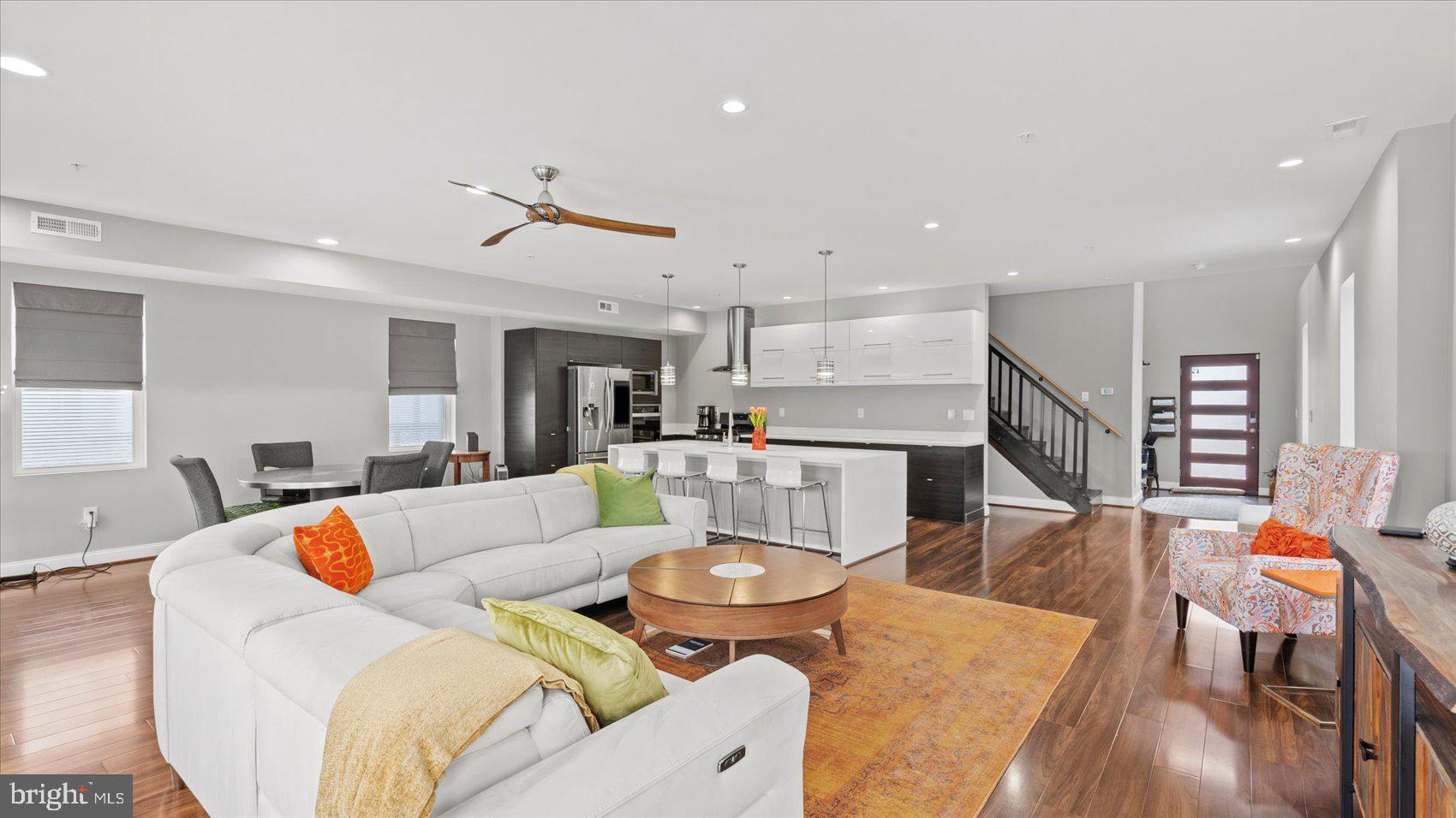 3145 Baybriar Road Dundalk, MD 21222 - Photo 21 of 54 a living room with furniture kitchen view and a wooden floor