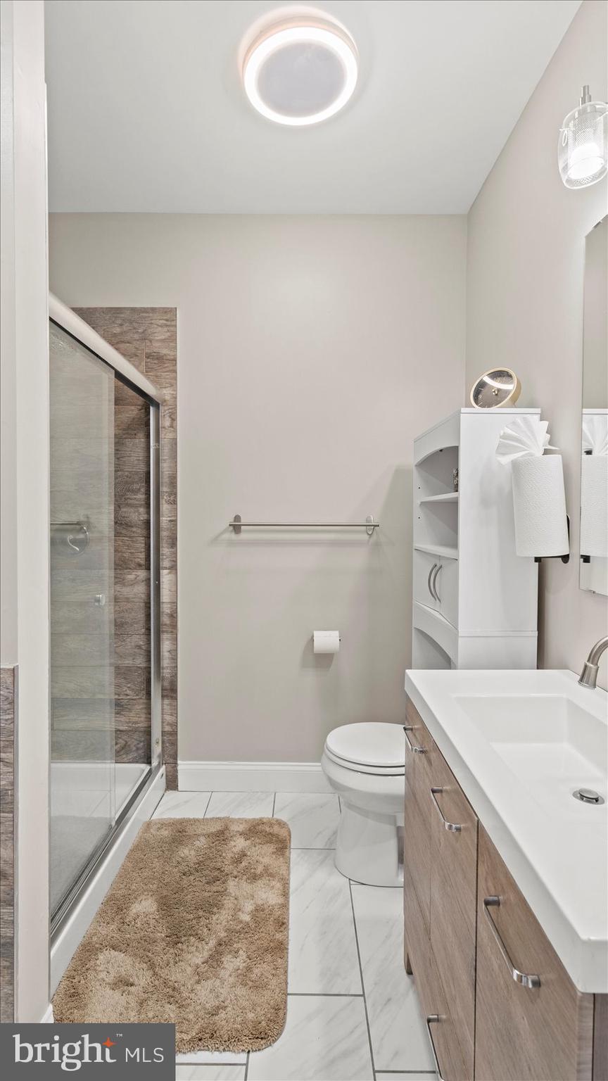 3145 Baybriar Road Dundalk, MD 21222 - Photo 42 of 54 a bathroom with a sink a toilet and shower