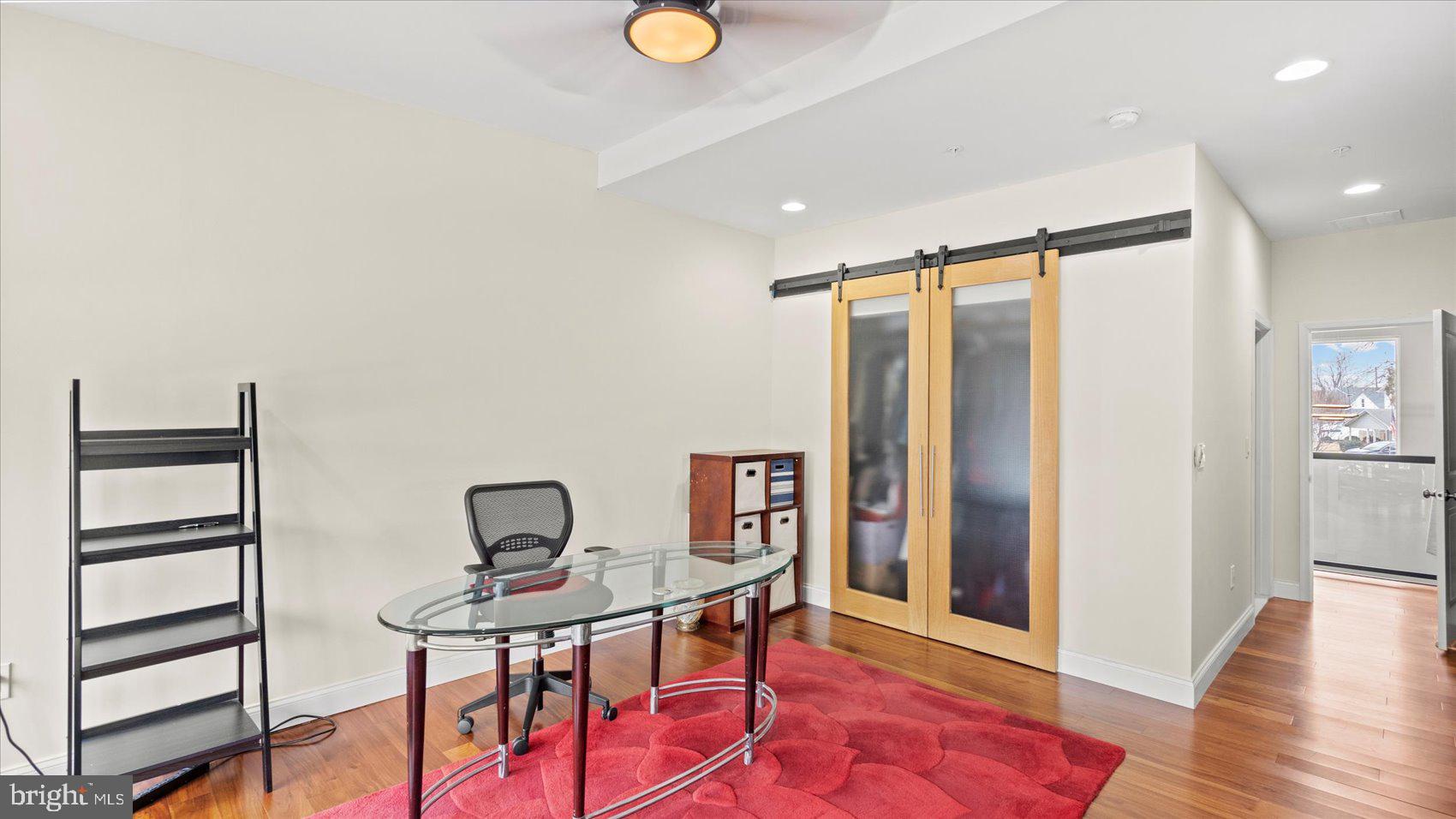 3145 Baybriar Road Dundalk, MD 21222 - Photo 47 of 54 a view of a workspace with furniture and wooden floor