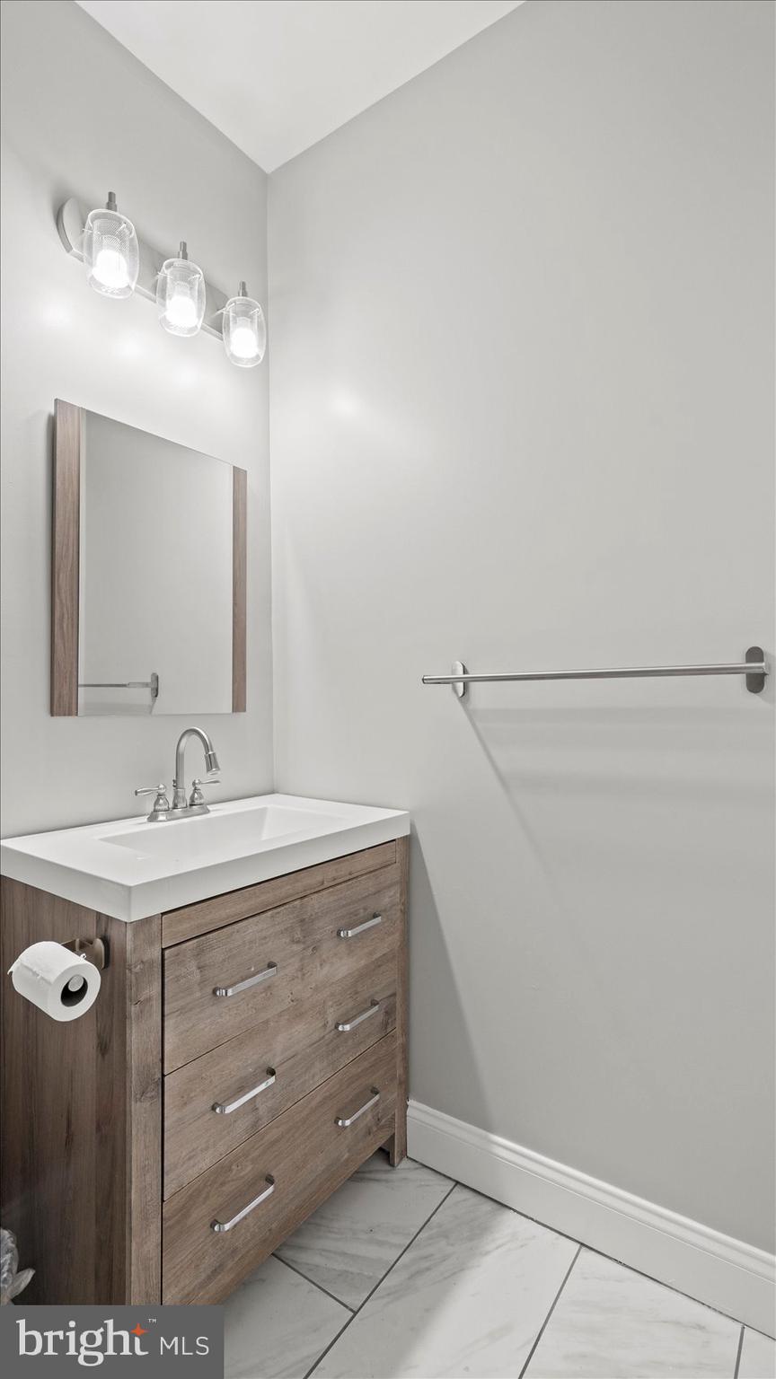 3145 Baybriar Road Dundalk, MD 21222 - Photo 50 of 54 a bathroom with a sink and a mirror