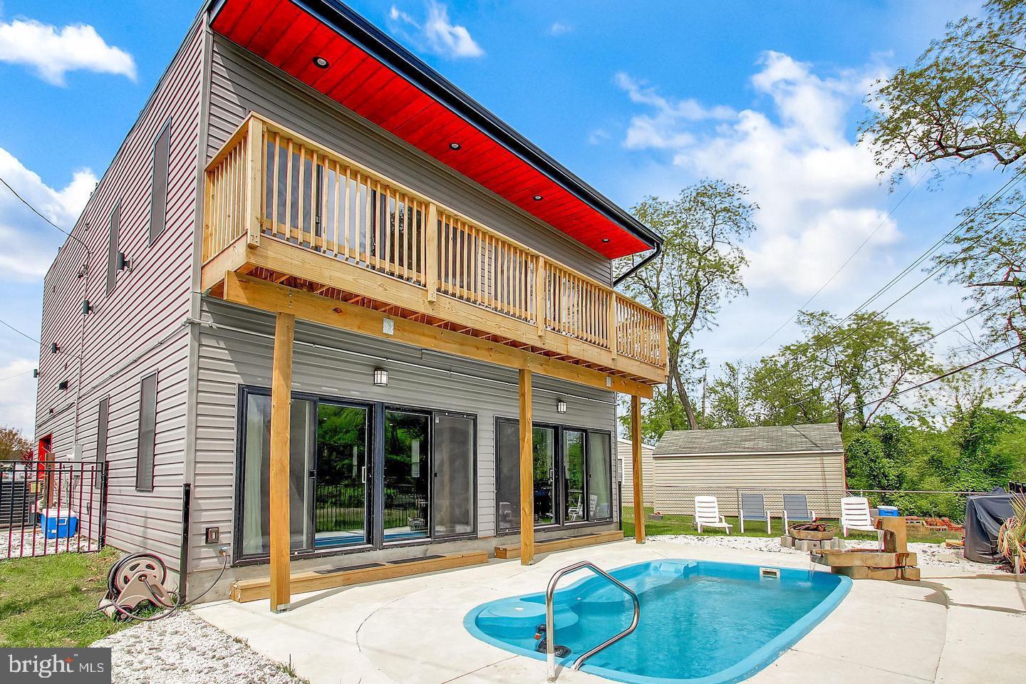 3145 Baybriar Road Dundalk, MD 21222 - Photo 6 of 54 a view of a house with a swimming pool and a yard