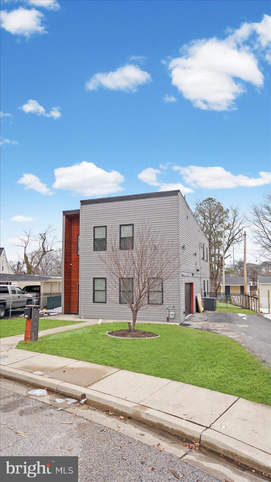 3145 Baybriar Road Dundalk, MD 21222 - Photo 8 of 54 a view of a big house with a big yard and large trees