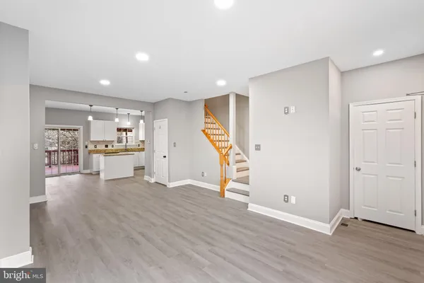 a view of kitchen with furniture and wooden floor