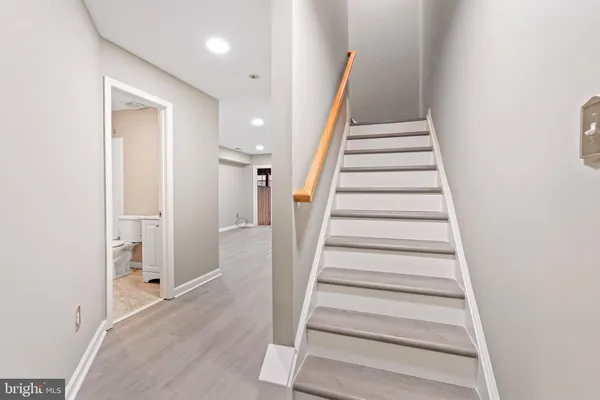 a view of an entryway with wooden floor