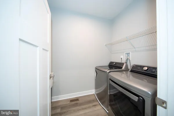 a kitchen with a stove and a refrigerator