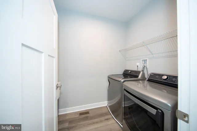 a kitchen with a stove and a refrigerator