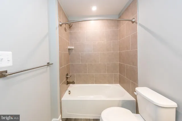 a bathroom with a shower and toilet
