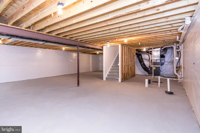 a view of a room with wooden walls