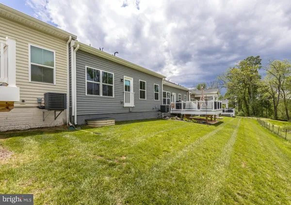 a view of a house with swimming pool and porch