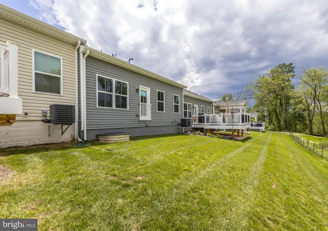 a view of a house with swimming pool and porch
